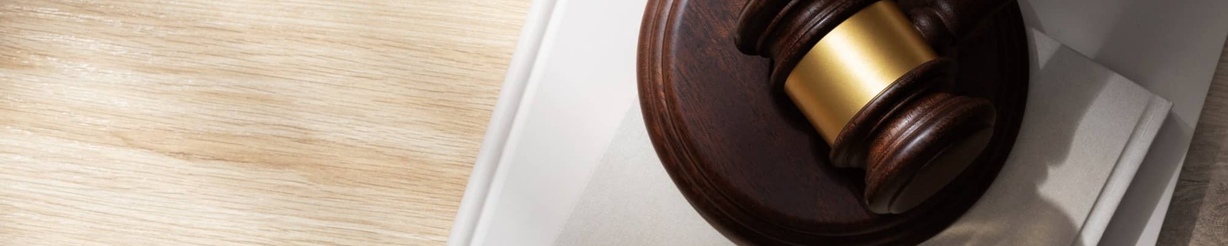 Gavel and legal balance on desk